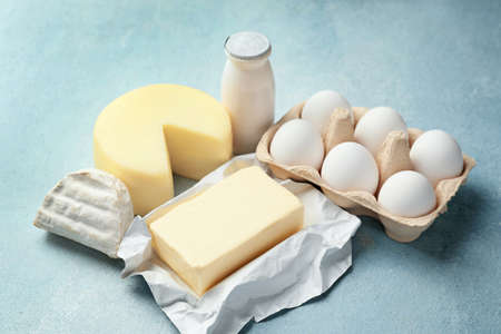 Different dairy products on color backgroundの写真素材