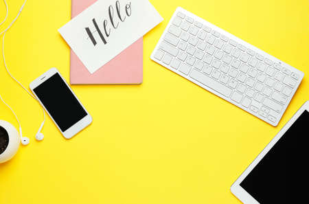 Computer keyboard with tablet PC, mobile phone and notebook on color backgroundの写真素材