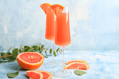 Glasses of tasty mimosa cocktails on tableの写真素材