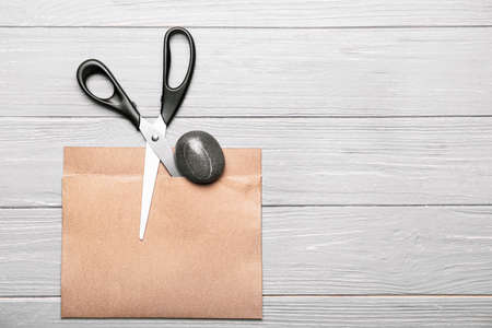 Scissors, rock and paper on wooden background
