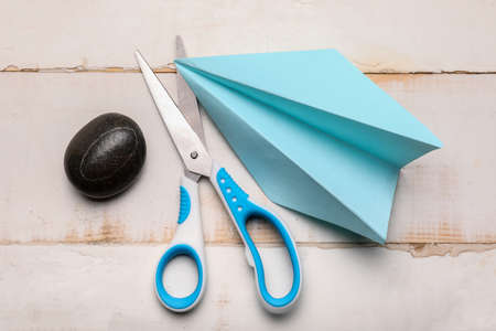 Scissors, rock and paper on wooden background