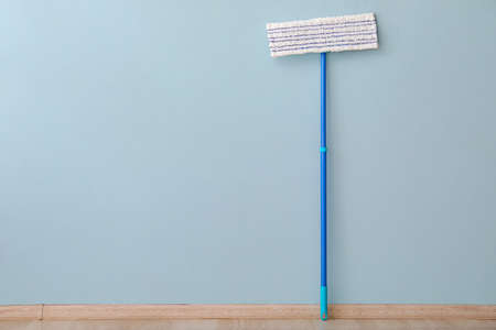 Floor mop near color wallの写真素材