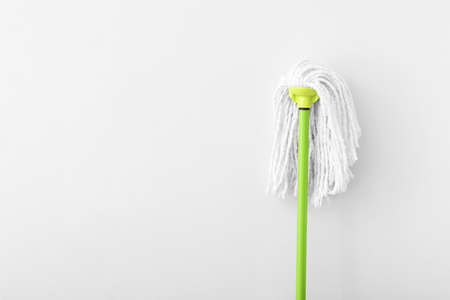 Floor mop on light background