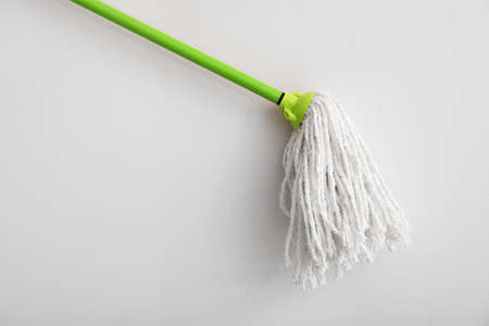 Floor mop on light backgroundの写真素材