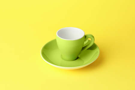 Empty cup on color backgroundの写真素材