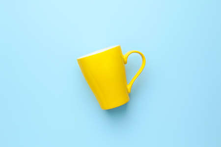 Empty cup on color backgroundの写真素材