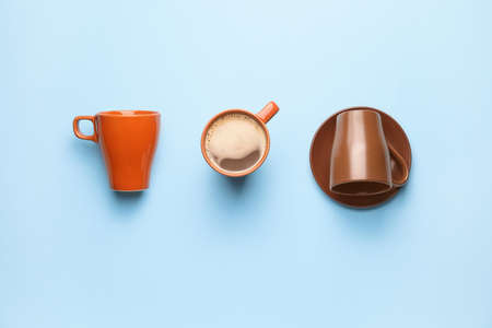 Composition with cups and coffee on color backgroundの写真素材
