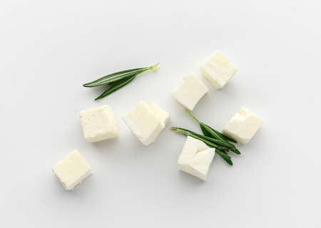 Tasty cut feta cheese on white backgroundの写真素材