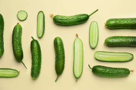 Green cucumbers on color backgroundの写真素材