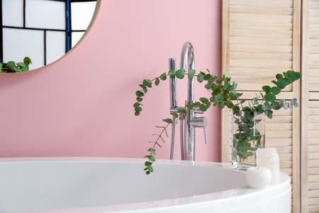 Interior of bathroom with floral decor