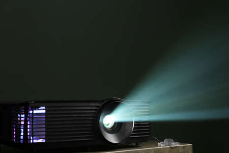 Modern video projector on dark backgroundの写真素材