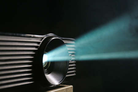 Modern video projector on dark background, closeup