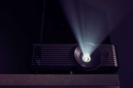 Modern video projector on dark backgroundの写真素材