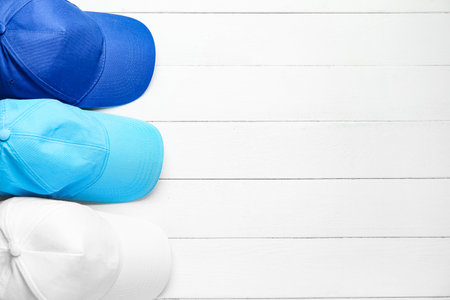 Blank caps on white wooden backgroundの写真素材