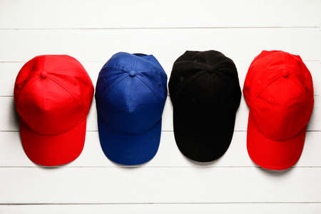 Blank caps on white wooden backgroundの写真素材