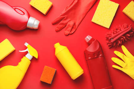 Set of cleaning supplies on color backgroundの写真素材