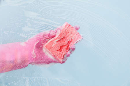 Housewife cleaning window at homeの写真素材