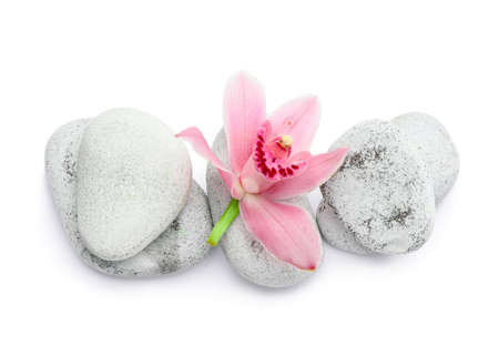 Spa stones and flower on white backgroundの写真素材