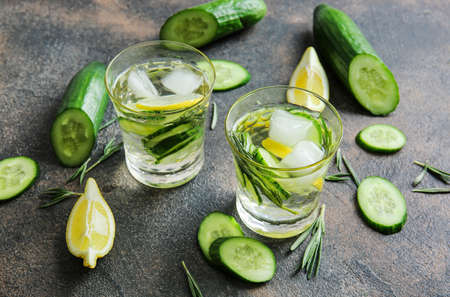 Glasses of infused cucumber water on dark backgroundの写真素材