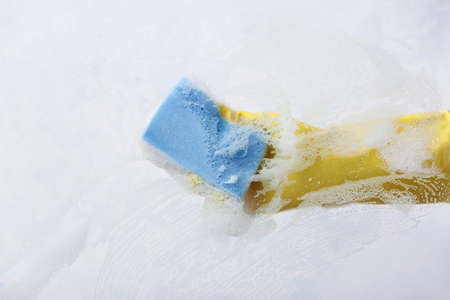 Housewife cleaning window at homeの写真素材