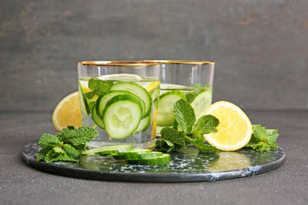 Glasses of infused cucumber water on dark backgroundの写真素材