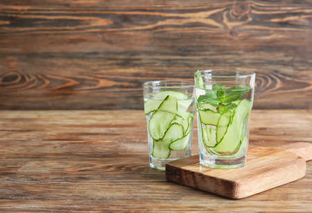 Glasses of infused cucumber water on tableの写真素材