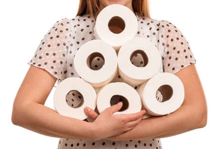 Woman with heap of toilet paper on white background.の写真素材