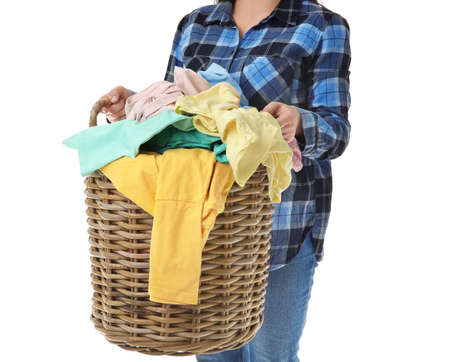 Woman with basket of laundry on white backgroundの写真素材