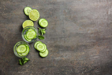 Glasses of infused cucumber water on dark backgroundの写真素材