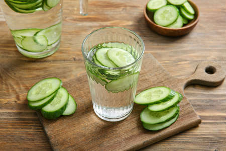 Glass of cucumber infused water on tableの写真素材