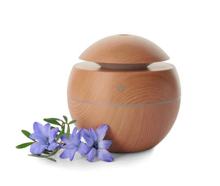 Aroma oil diffuser on white background
