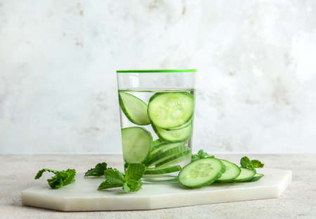 Glass of cucumber infused water on tableの写真素材