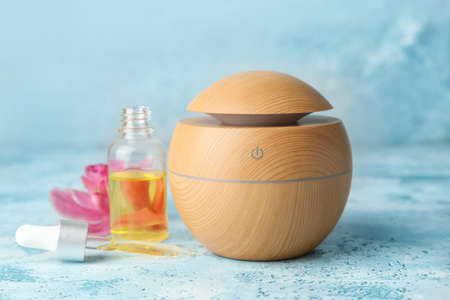 Aroma oil diffuser on color backgroundの写真素材