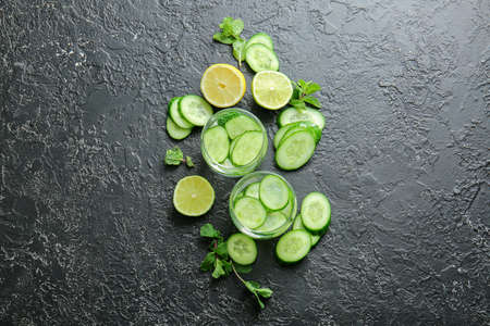 Glasses of cucumber infused water on tableの写真素材