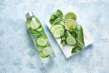 Composition with cucumber infused water on tableの写真素材