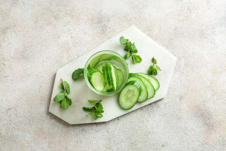 Glass of cucumber infused water on tableの写真素材
