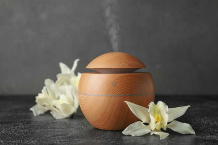 Aroma oil diffuser on dark backgroundの写真素材