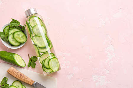 Composition with cucumber infused water on color backgroundの写真素材