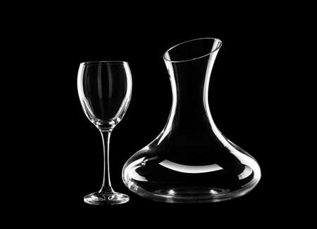 Empty decanter and glass on dark backgroundの写真素材