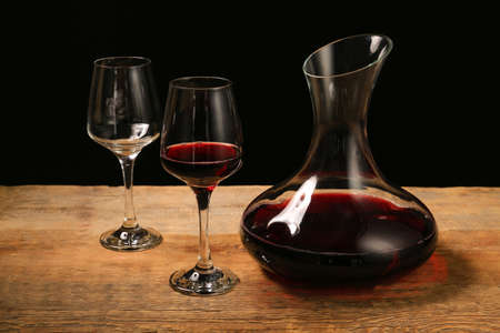 Glassware of tasty wine on tableの写真素材