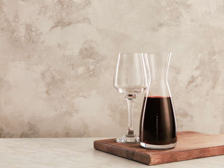 Decanter of wine and glass on tableの写真素材