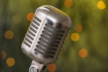 Retro microphone on dark background with blurred lightsの写真素材