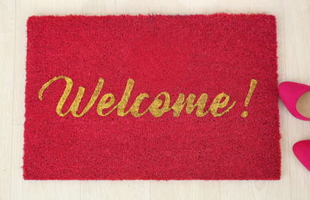 Door mat and shoes on floorの写真素材