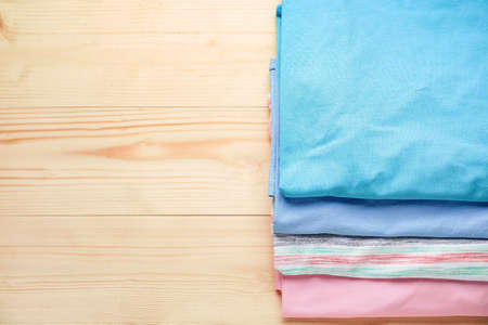 Clean clothes on wooden backgroundの写真素材