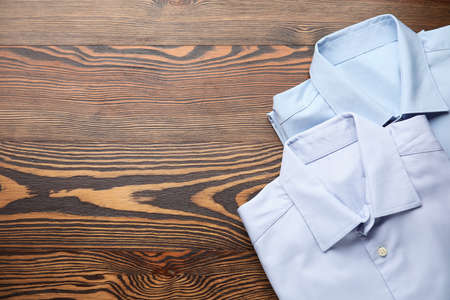 Clean clothes on wooden backgroundの写真素材