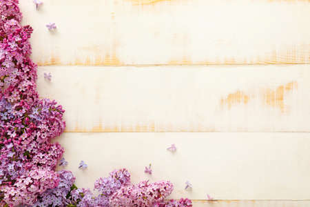 Beautiful lilac flowers on wooden backgroundの写真素材
