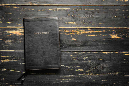Holy Bible on wooden background