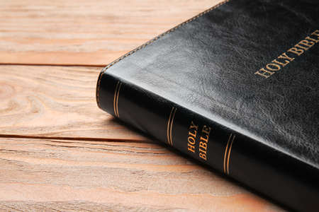 Holy Bible on wooden background, closeup