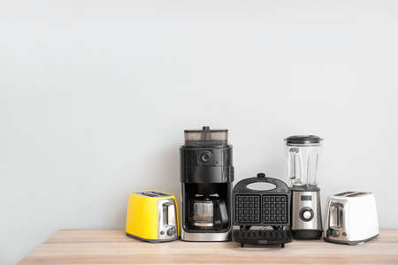 Different household appliances on tableの写真素材