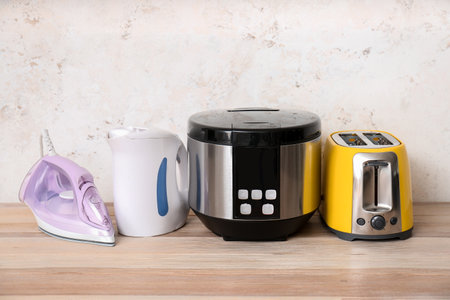 Different household appliances on tableの写真素材